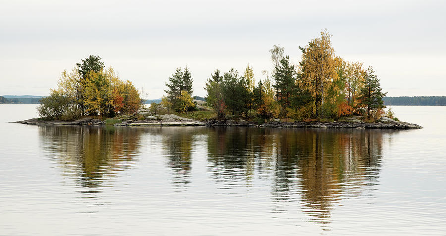 Island in a lake with trees in autumn. Kuopio finland europe Photograph by Michalakis Ppalis