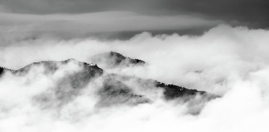 Islands in the clouds Photograph by Gary Browne