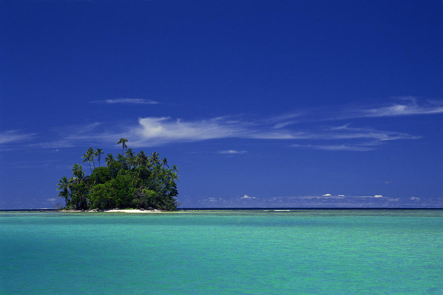 Isolated coral island in South Pacific Photograph by Comstock