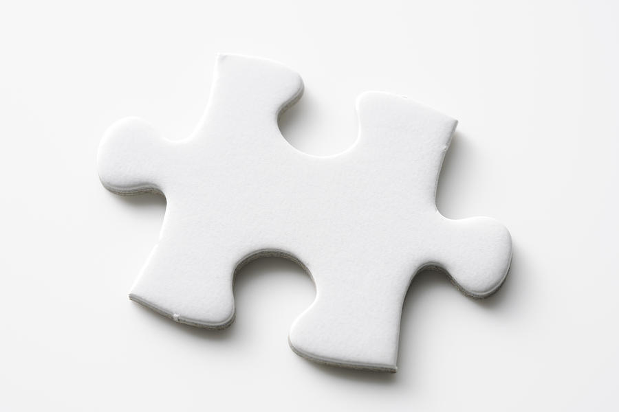 Isolated shot of blank jigsaw puzzles piece on white background Photograph by Kyoshino