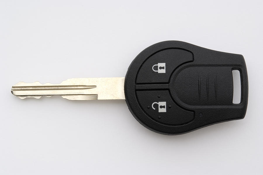 Isolated shot of new car key on white background Photograph by Kyoshino
