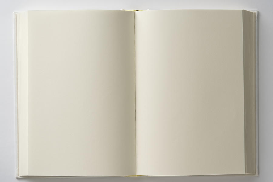 Isolated shot of opened blank white book on white backgrounds Photograph by Kyoshino