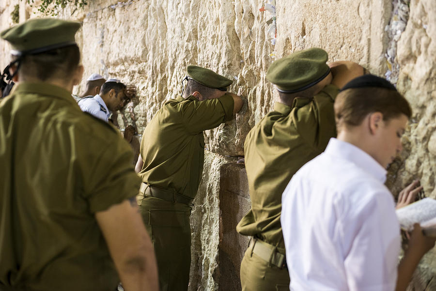 Israeli soldiers praying at the Western Wall in Jerusalem Photograph by Joel Carillet
