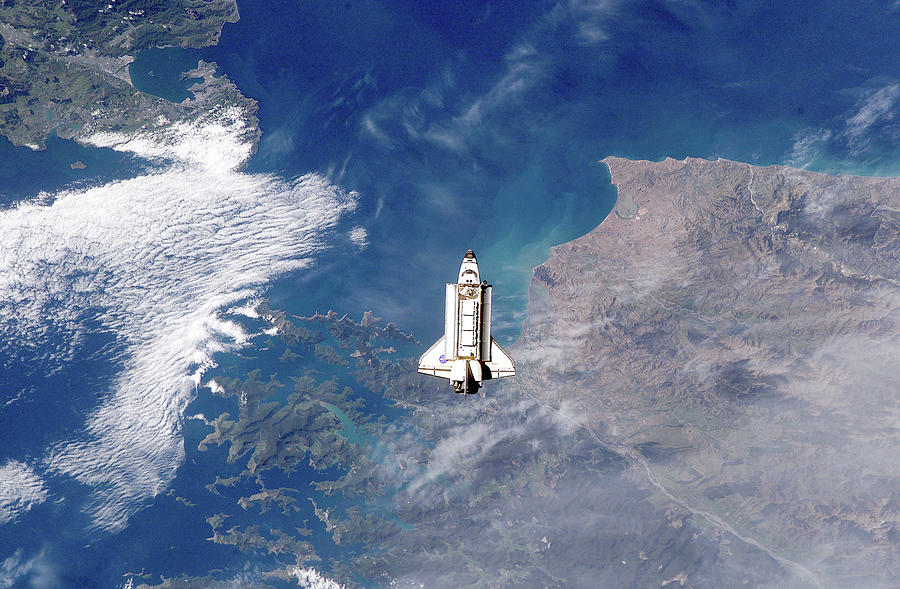 Space Photograph - ISS eye view of Shuttle docking by Nasa