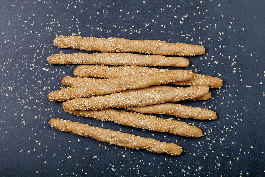 Italian grissini or salted bread sticks with sesame seeds on bla Photograph  by Liss Art Studio - Fine Art America