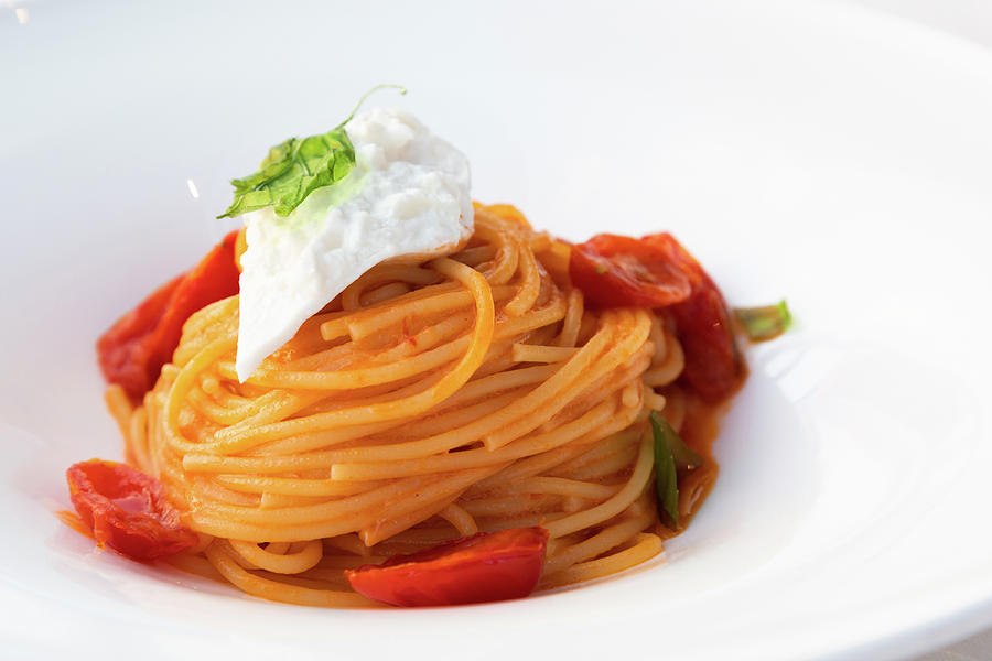 Italian pasta - spaghetti with mozzarella cheese closeup, medite ...