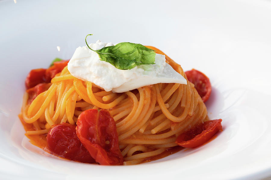 Italian pasta - spaghetti with stracciatella cheese closeup, med ...