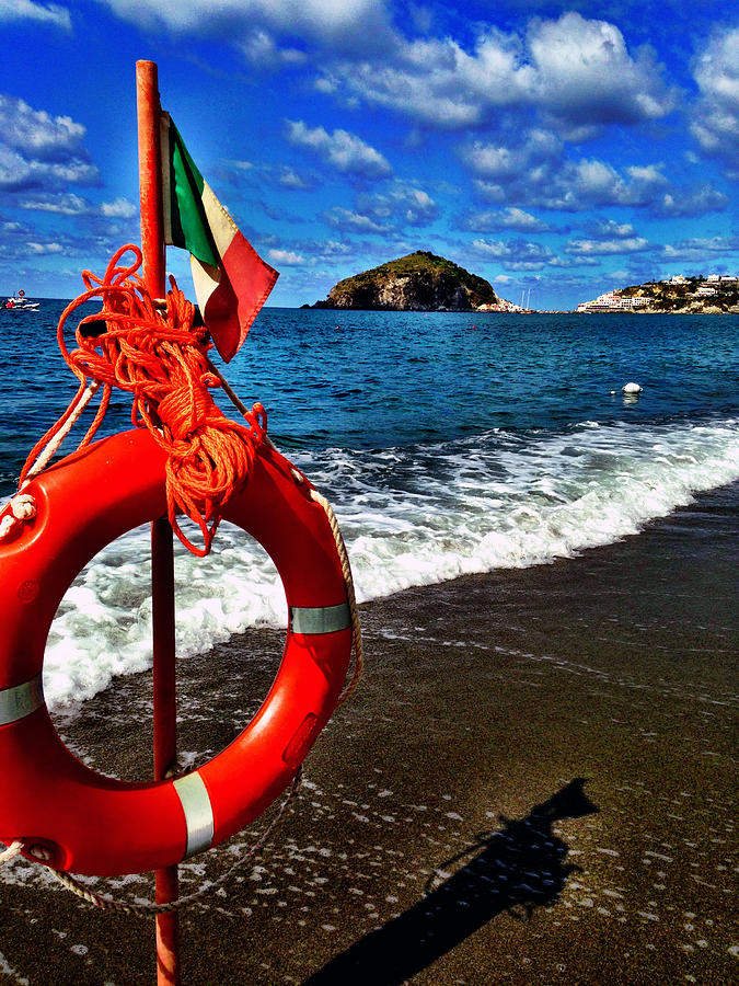 Italy, Ischia, Life preserver on wooden post on beach Photograph by Stephenvellecca