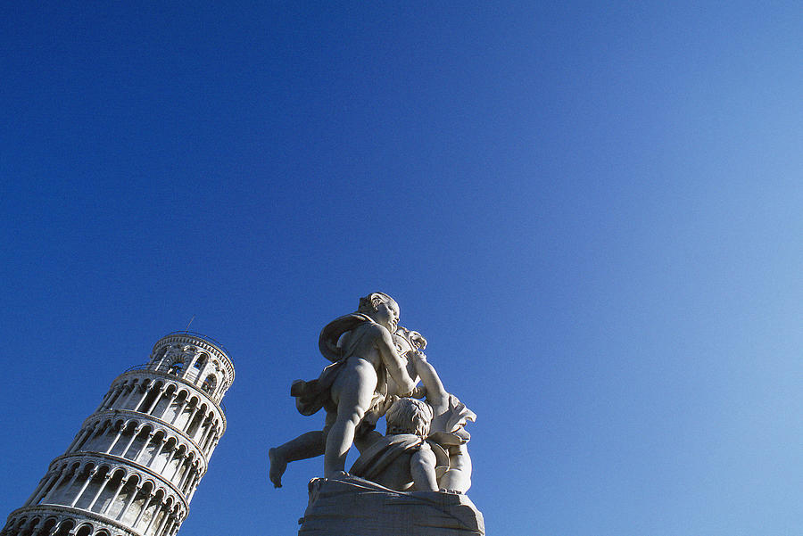 Italy, Pisa, leaning tower and statue Photograph by James Hardy