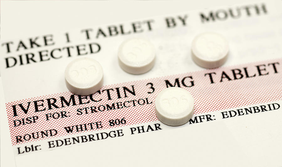 Ivermectin pills (a broad-spectrum antiparasitic agent) on top of instruction label Photograph by Callista Images