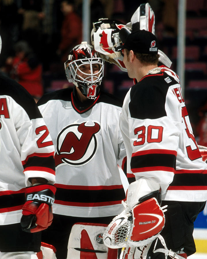 J-F Damphousse is congratulated by Martin Brodeur... Photograph by A Marlin