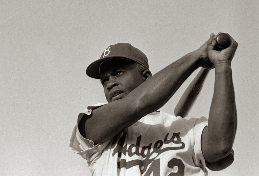 Jackie Robinson in Brooklyn Dodgers, swinging bat by American Photo