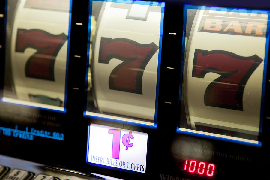 Jackpot!  Winning combination on a slot machine Photograph by Alina555