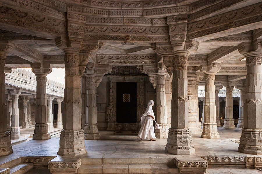 Jain nun walking in white marble Ranakpur temple Photograph by Marji Lang