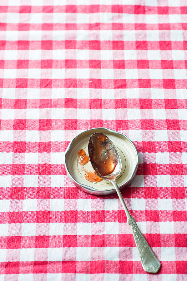 Jam on a spoon Photograph by Image Source
