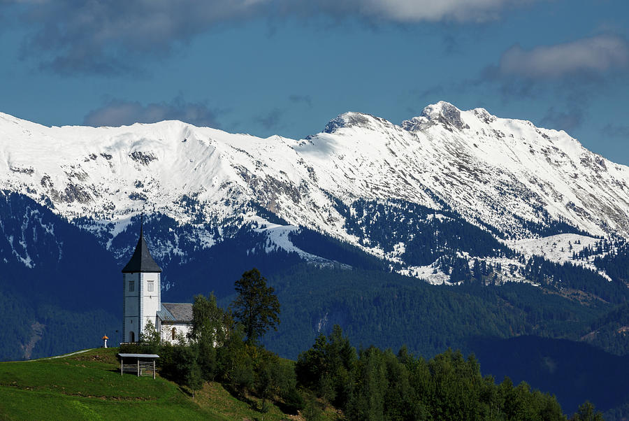 Jamnik church with Karavanke Alps backdrop Photograph by Ian Middleton