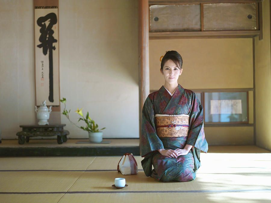 Japan, Kyoto, Enko Temple, woman in kimono kneeling in temple, portrait Photograph by Michael H