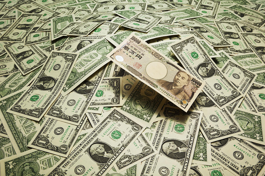 japan yen  on the  US dollar banknotes Photograph by Yuji Sakai
