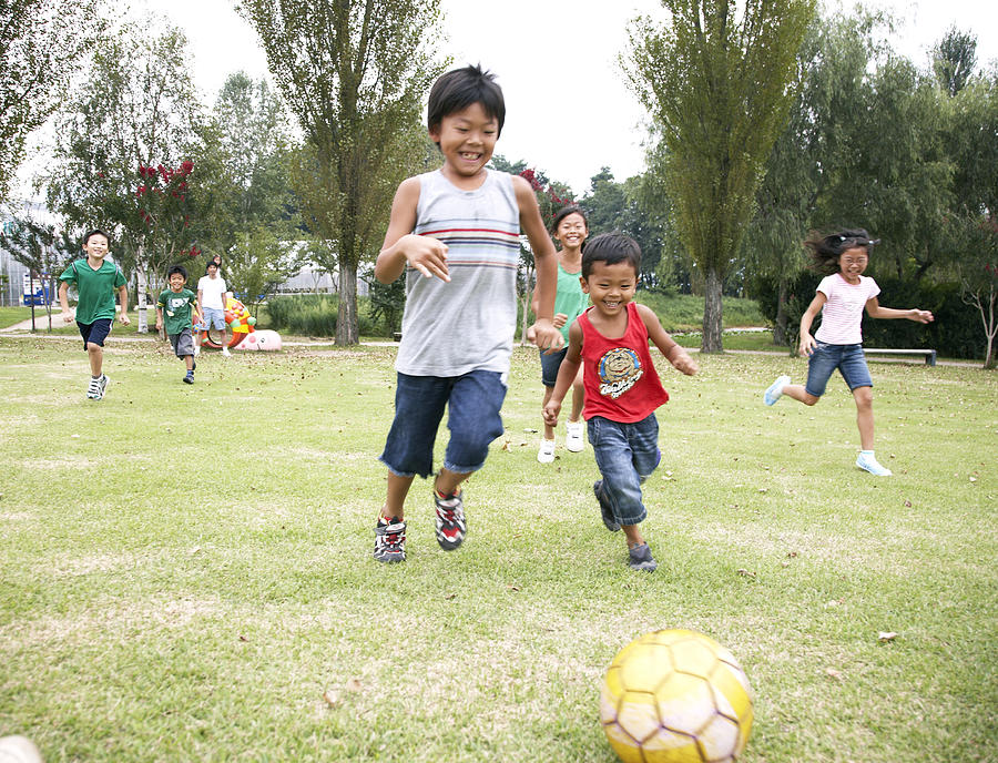 Japanese children playing soccer Photograph by Seiya Kawamoto