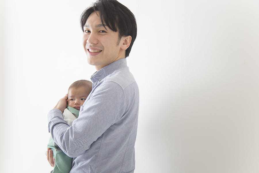 Japanese father holding a baby Photograph by Milatas