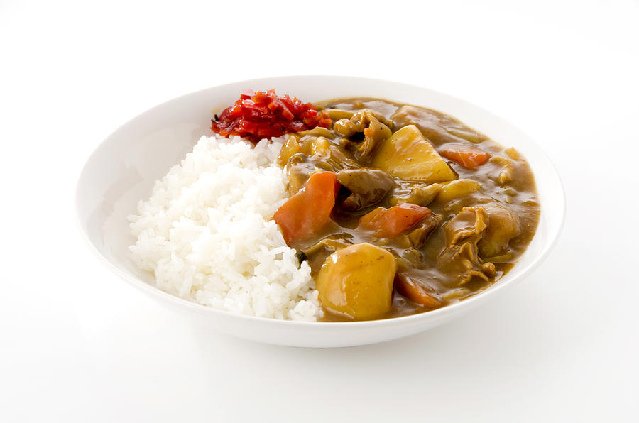 Japanese food, pork curry with rice on white background Photograph by Karimitsu