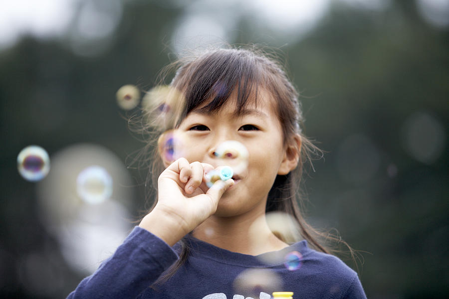Japanese girl blowing bubbles Photograph by Seiya Kawamoto