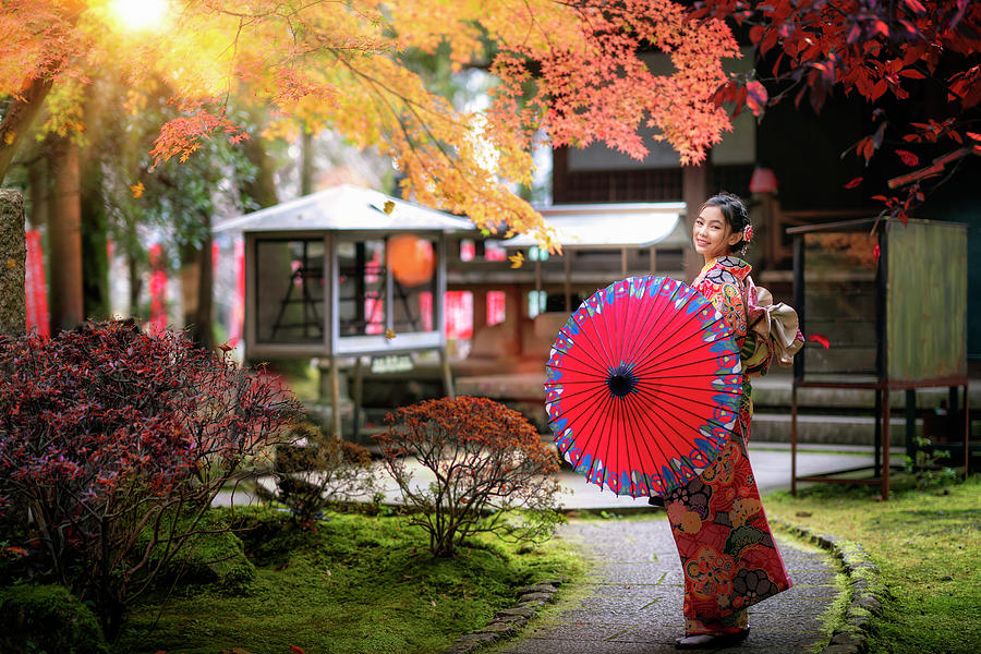 Japanese girl walk in temple Photograph by Anek Suwannaphoom
