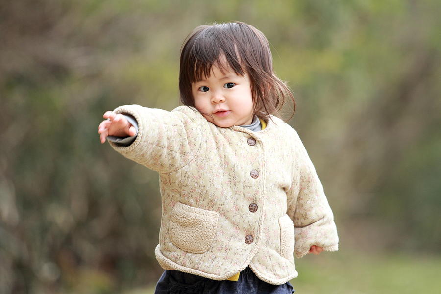 Japanese girl walking on the grass (1 year old) Photograph by Ziggy_mars