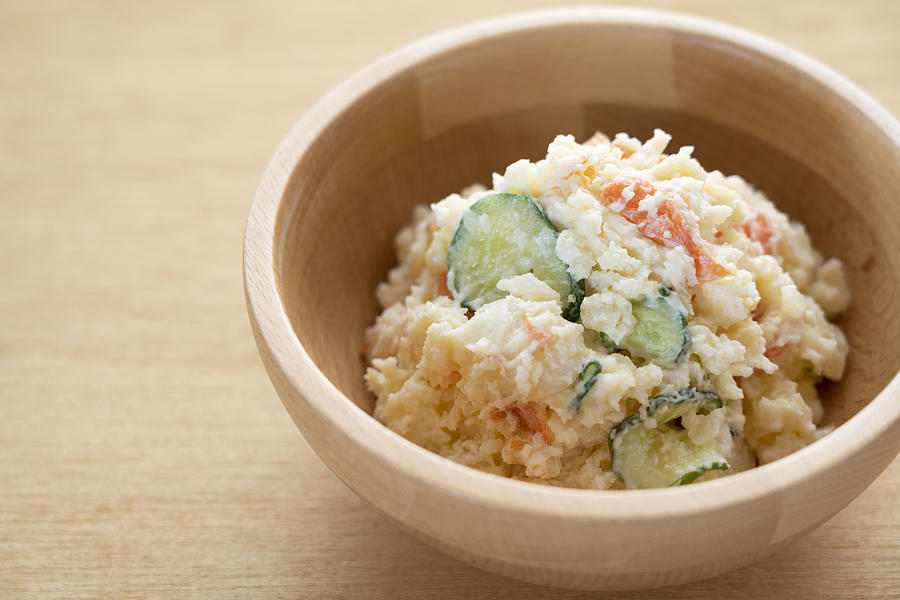 Japanese potato salad on a wooden background Photograph by Masa44
