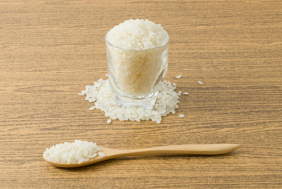 Japanese Rice in Wooden Spoon and Glass Photograph by Arayabandit