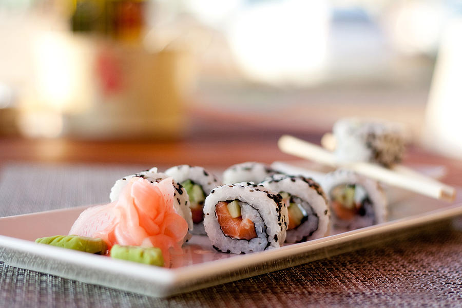 Japanese seafood sushi, roll and chopstick on white plate Photograph by SilviaMilanova
