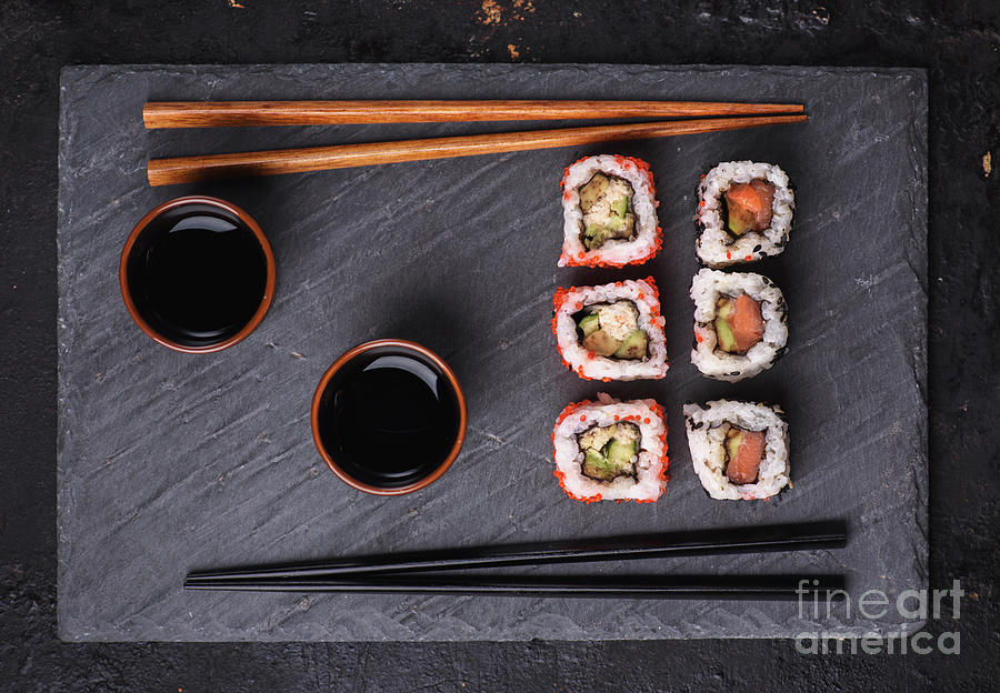Japanese sushi rolls on black slate Photograph by Jelena Jovanovic