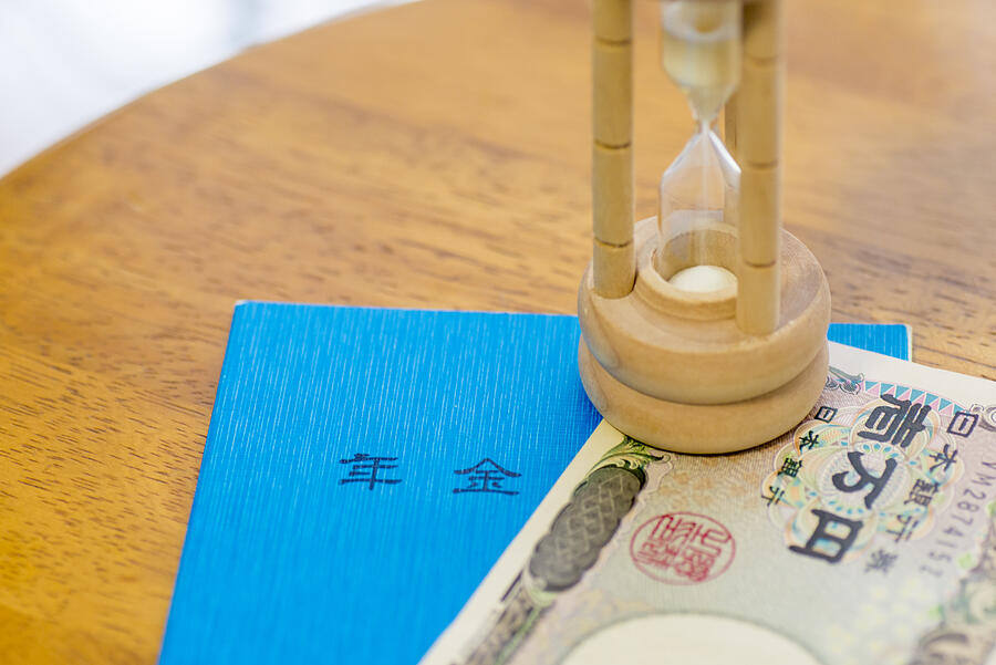 Japanese Ten Thousand Yen Note, Pension Book And Hourglass Photograph by Itasun
