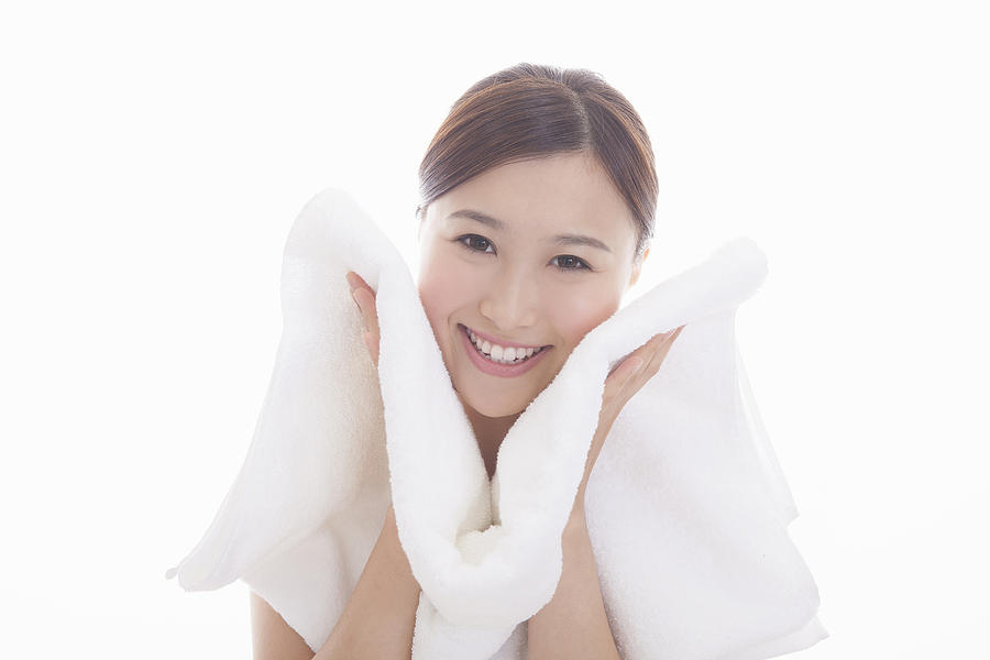 Japanese woman wiping the face with a towel Photograph by Milatas