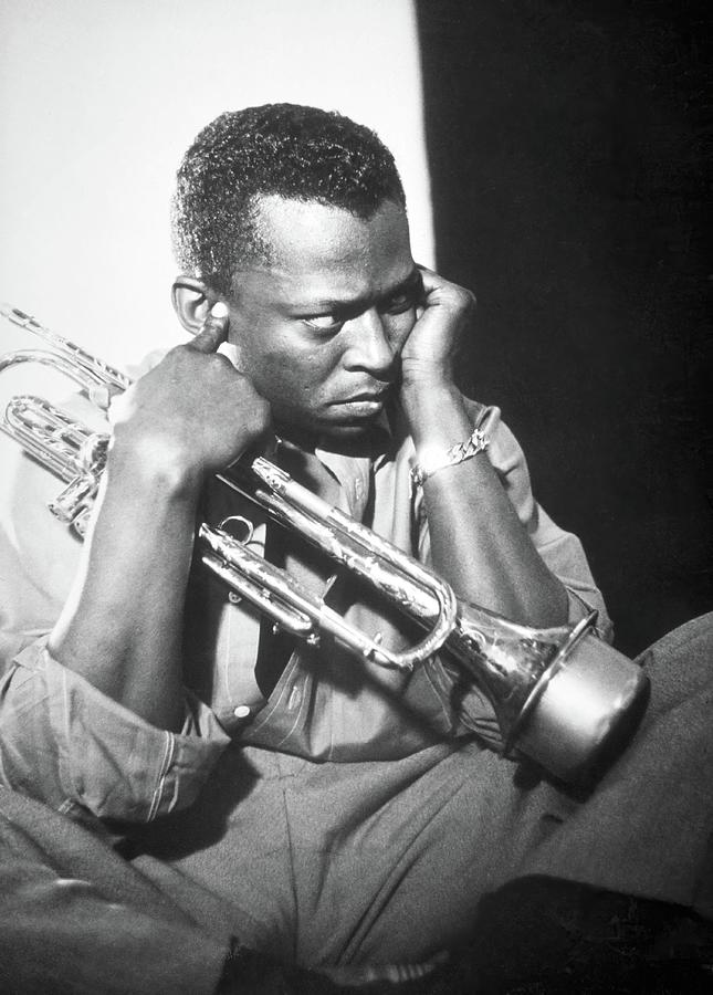 Jazz trumpeter Miles Davis early in his career playing in New York City, circa 1955. Photograph by Album