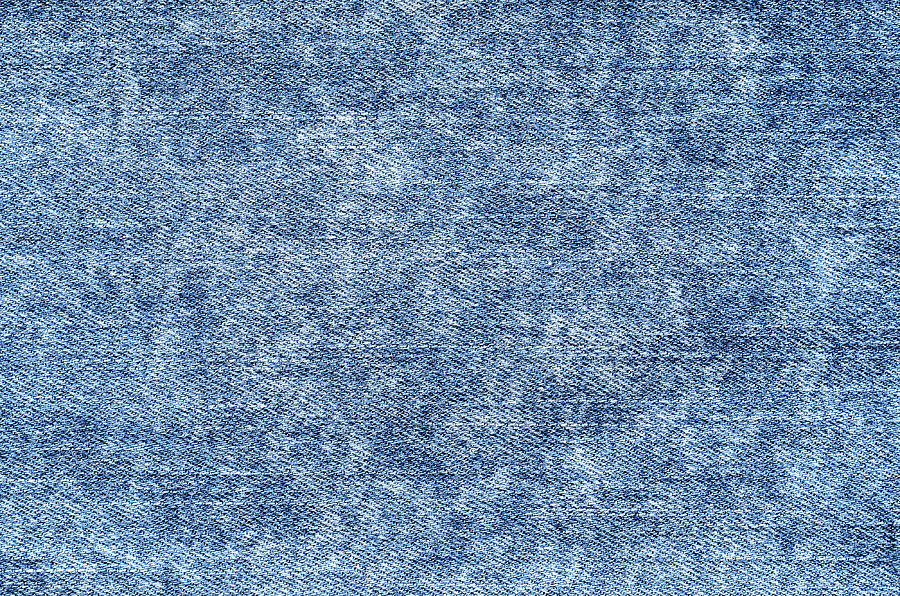 Jeans in acid wash blue. Denim background, texture, close up. Faded ...