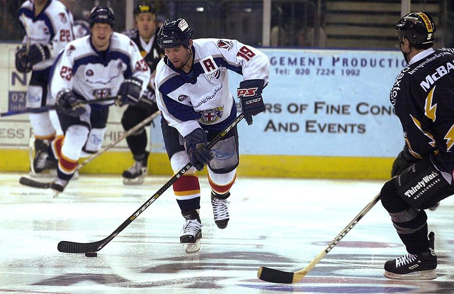 Jeff Hoad of the Knights takes on the Bees defence Photograph by Dan Regan