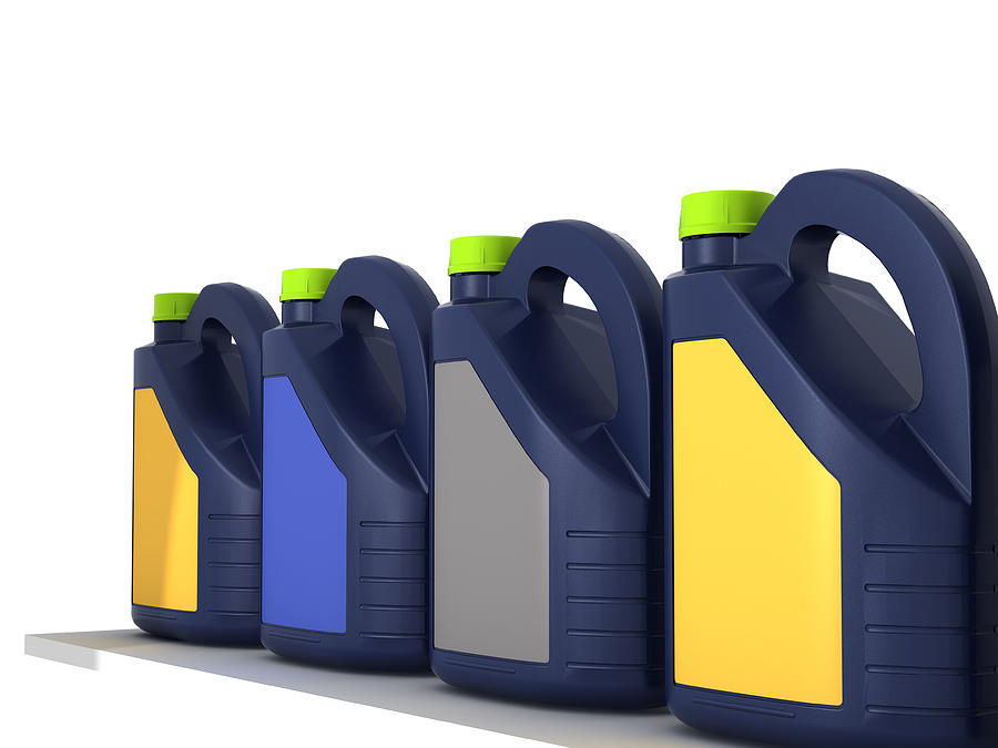 Jerrycans with car engine oil - isolated Photograph by Imegastocker