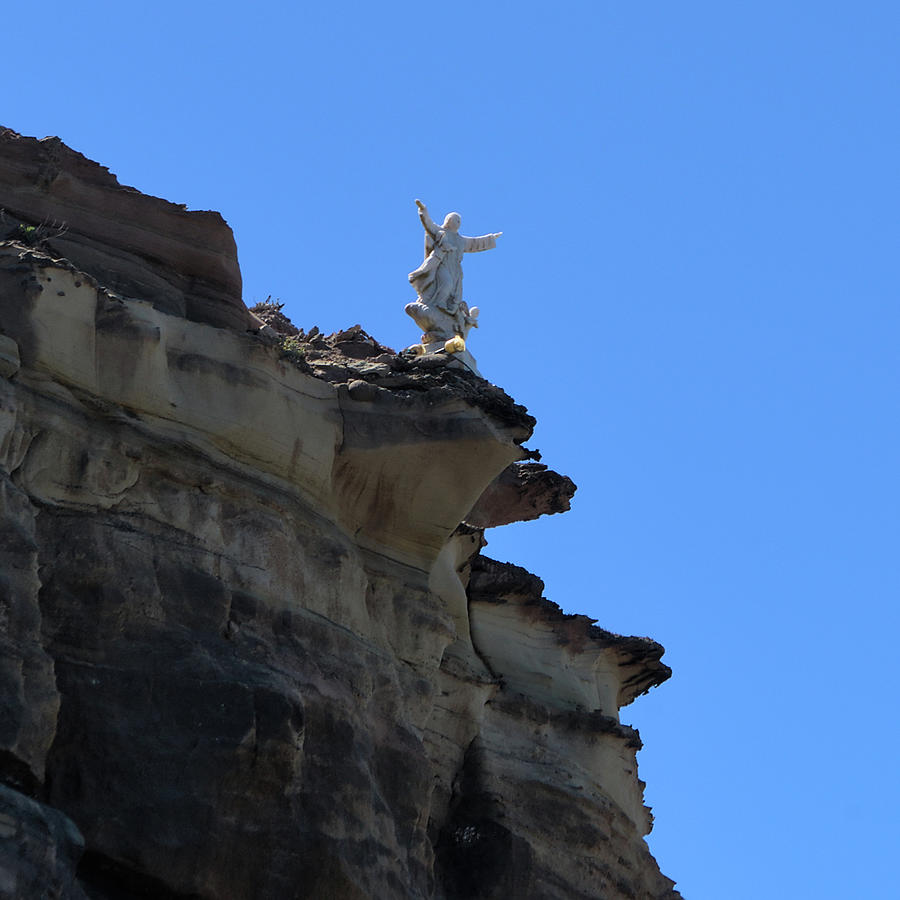 Jesus Statue on the cliffs of Porto Dinheiro Beach Photograph by Angelo DeVal