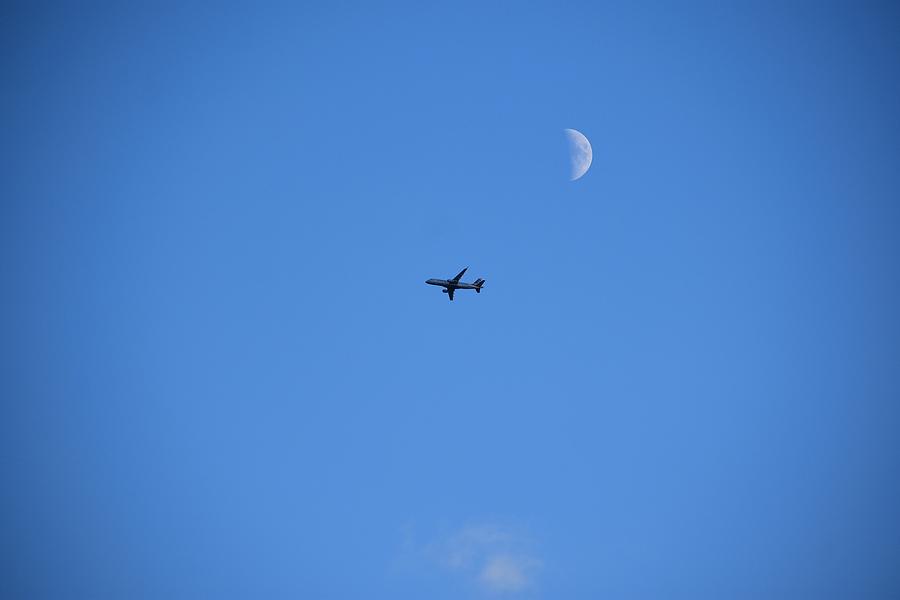 Jet Flying By The Moon Photograph