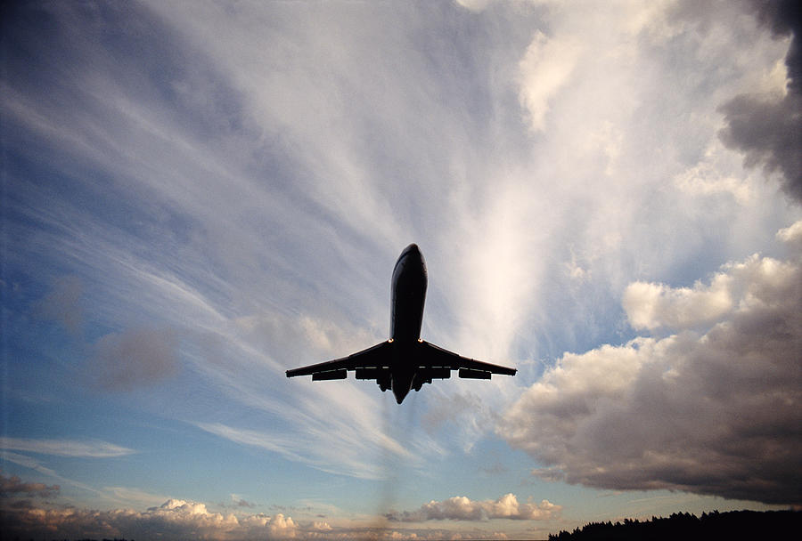 Jet Landing In Seattle Photograph by Tim Bieber