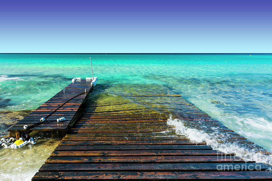Jetty and ramp on the beach Photograph by Vicente Sargues