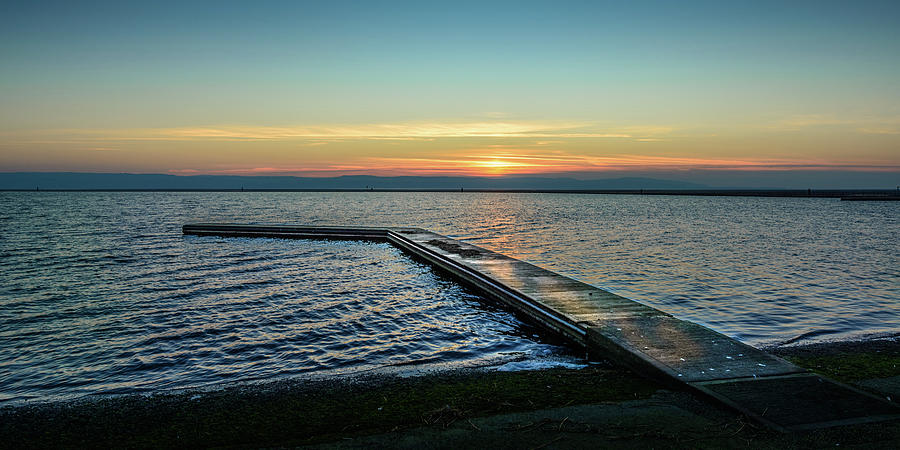 Sunset Photograph - Jetty on the Marine Lake, West Kirby by Peter OReilly