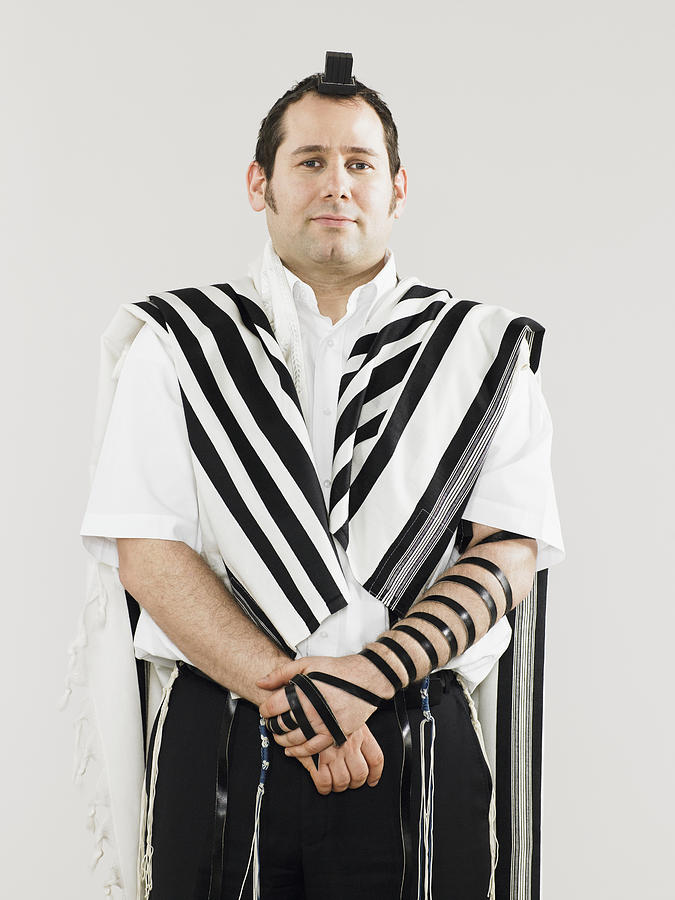 Jewish man wearing tallit and teffillin for prayers Photograph by Image Source