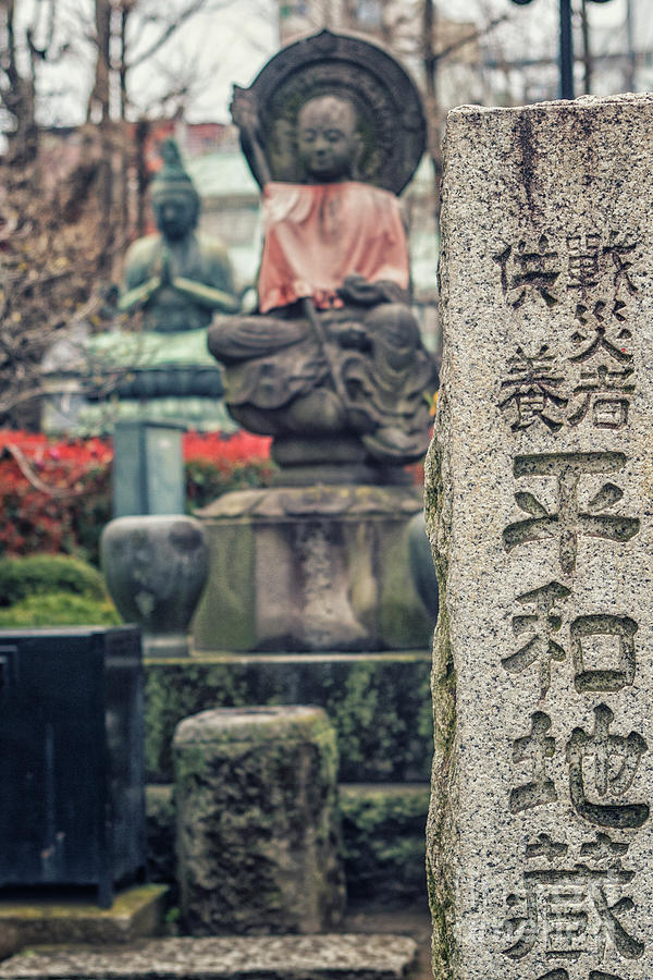 Jizo statue at Senso Ji temple in Tokyo Photograph by Patricia Hofmeester