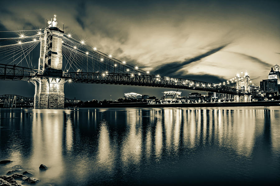 Cincinnati Bengals Photograph - John A. Roebling Bridge On The Ohio River in Sepia - Cincinnati by Gregory Ballos