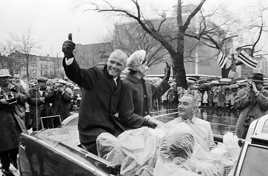 John and Annie Glenn Riding In Car During Parade - 1962 Photograph by War Is Hell Store