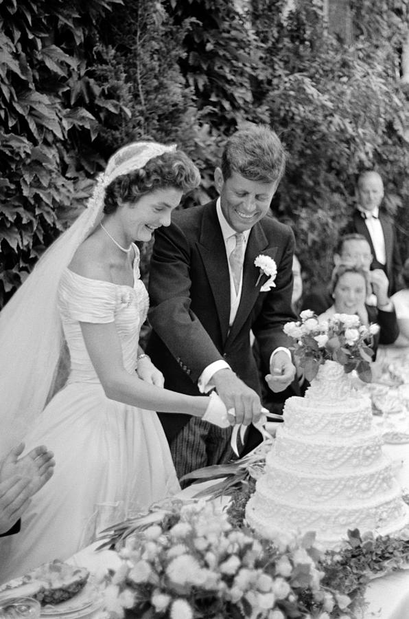 John and Jackie Kennedy Cutting Their Wedding Cake - 1953 Photograph by War Is Hell Store