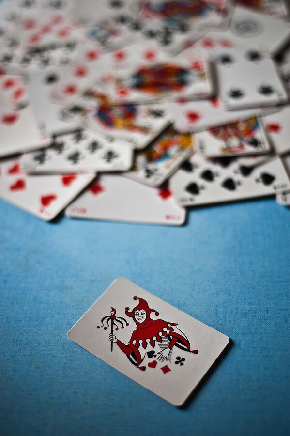 Joker card + playing cards Photograph by Franck Metois Joker card + playing cards Photograph by Franck Metois