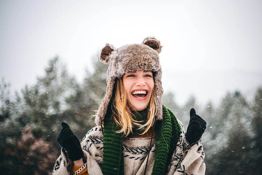 Joyful young woman enjoys cold winter day in mountains Photograph by Hobo_018